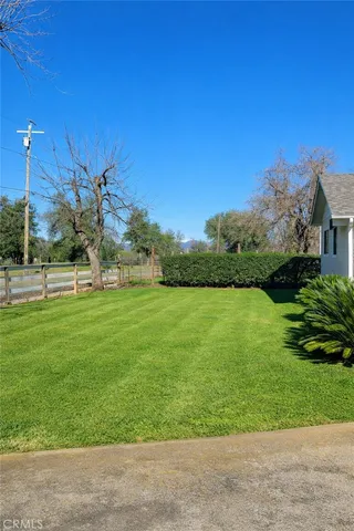 a view of grassy field with benches