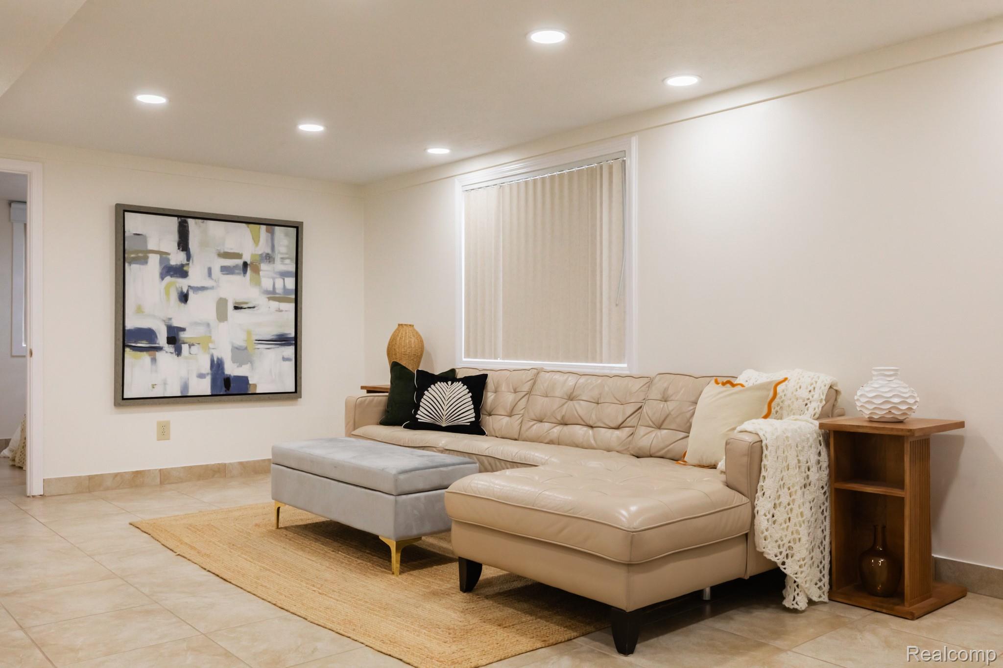 3882 Okemos Road Okemos, MI 48864 - Photo 29 of 50 Bright, open living space featuring recessed ceiling lighting, neutral wall finishes, and tile flooring