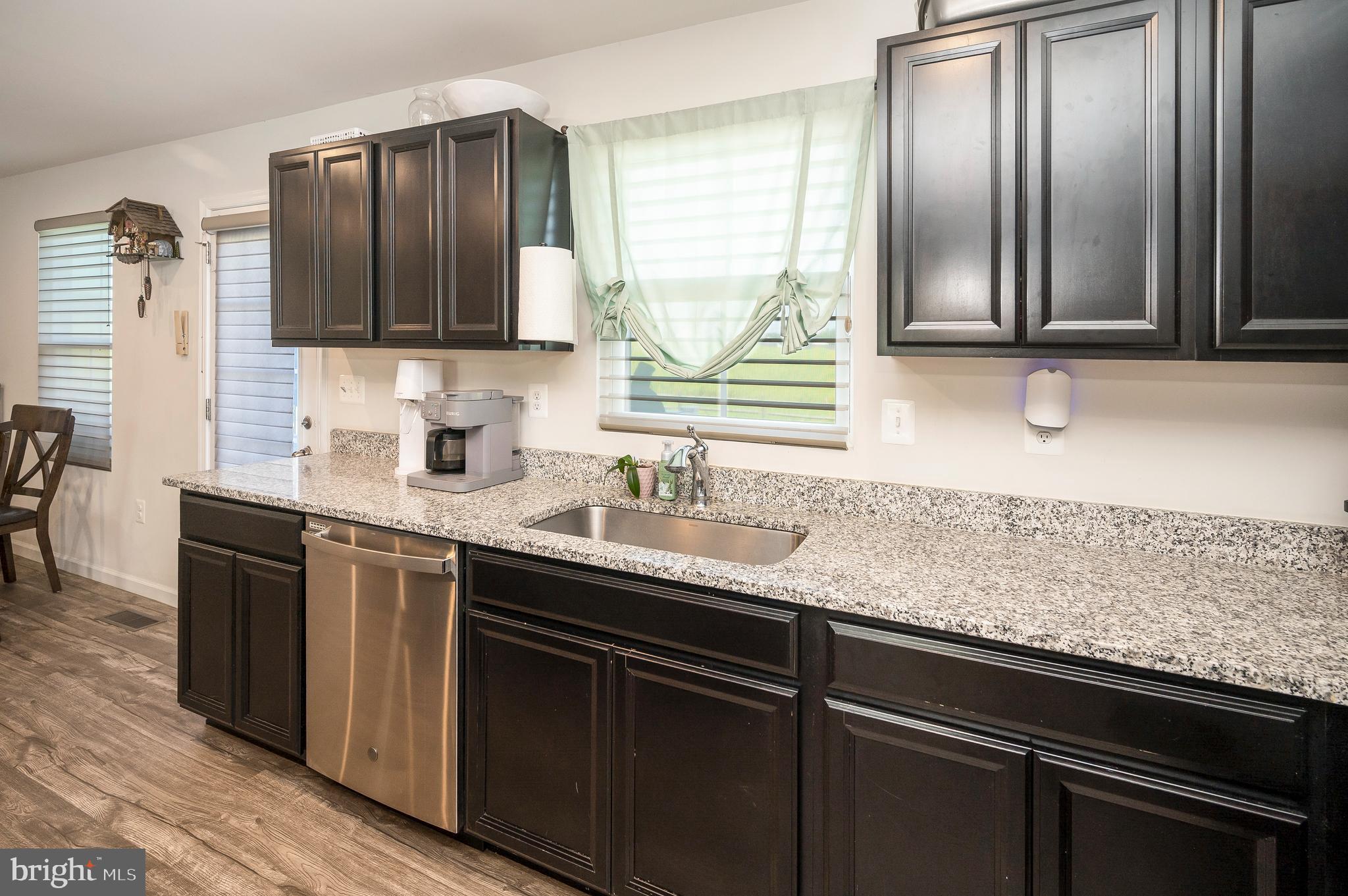 12062 Rundle Crossing King George, VA 22485 - Photo 13 of 67 a kitchen with granite countertop stainless steel appliances and sink