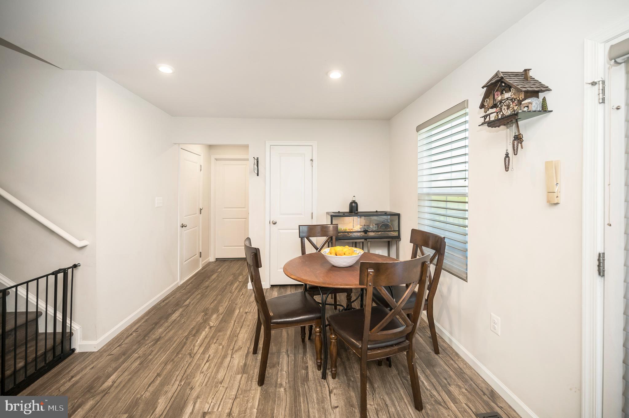 12062 Rundle Crossing King George, VA 22485 - Photo 16 of 67 a view of a dining room with furniture and wooden floor