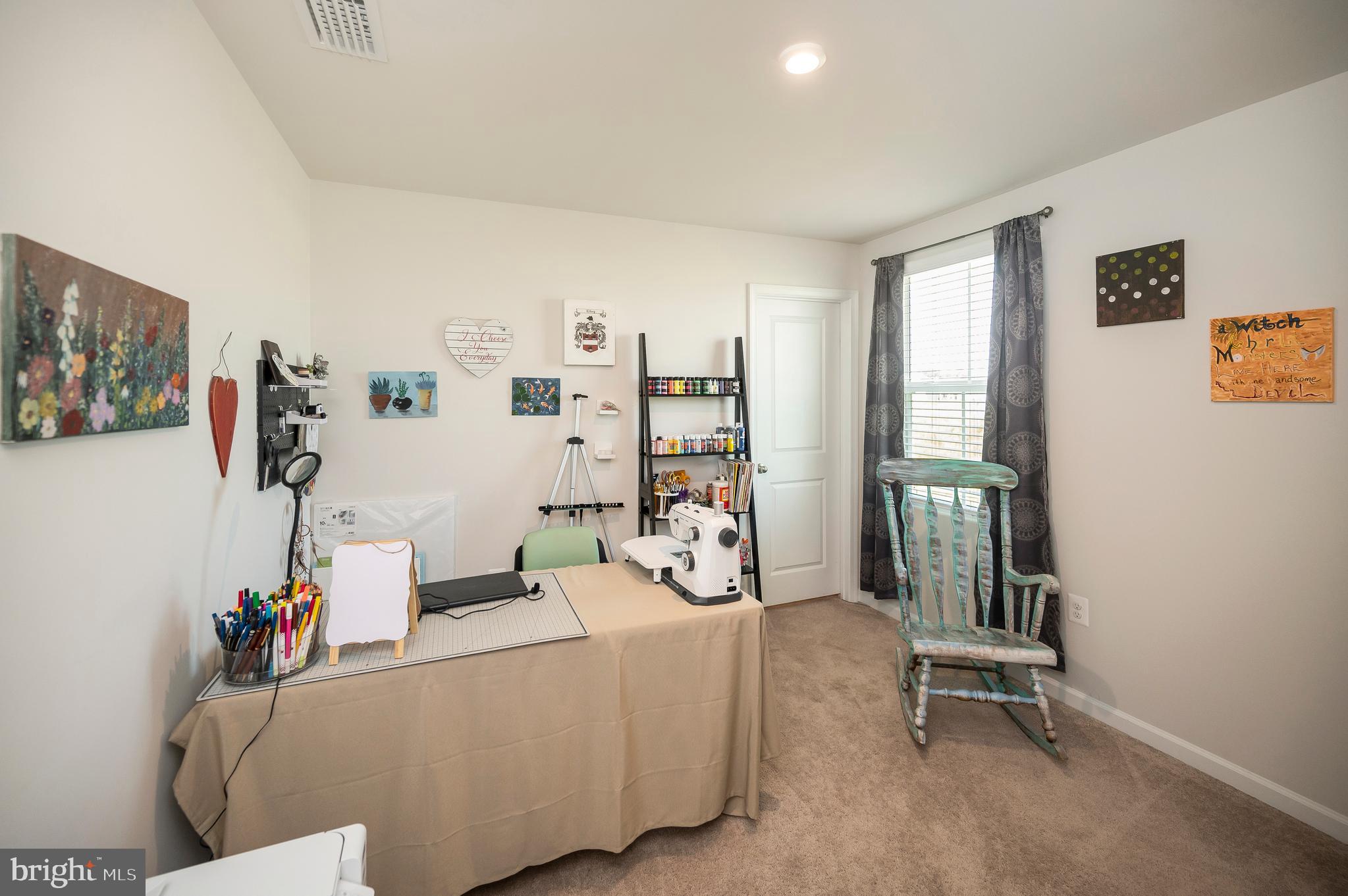 12062 Rundle Crossing King George, VA 22485 - Photo 30 of 67 a living room with furniture and a flat screen tv