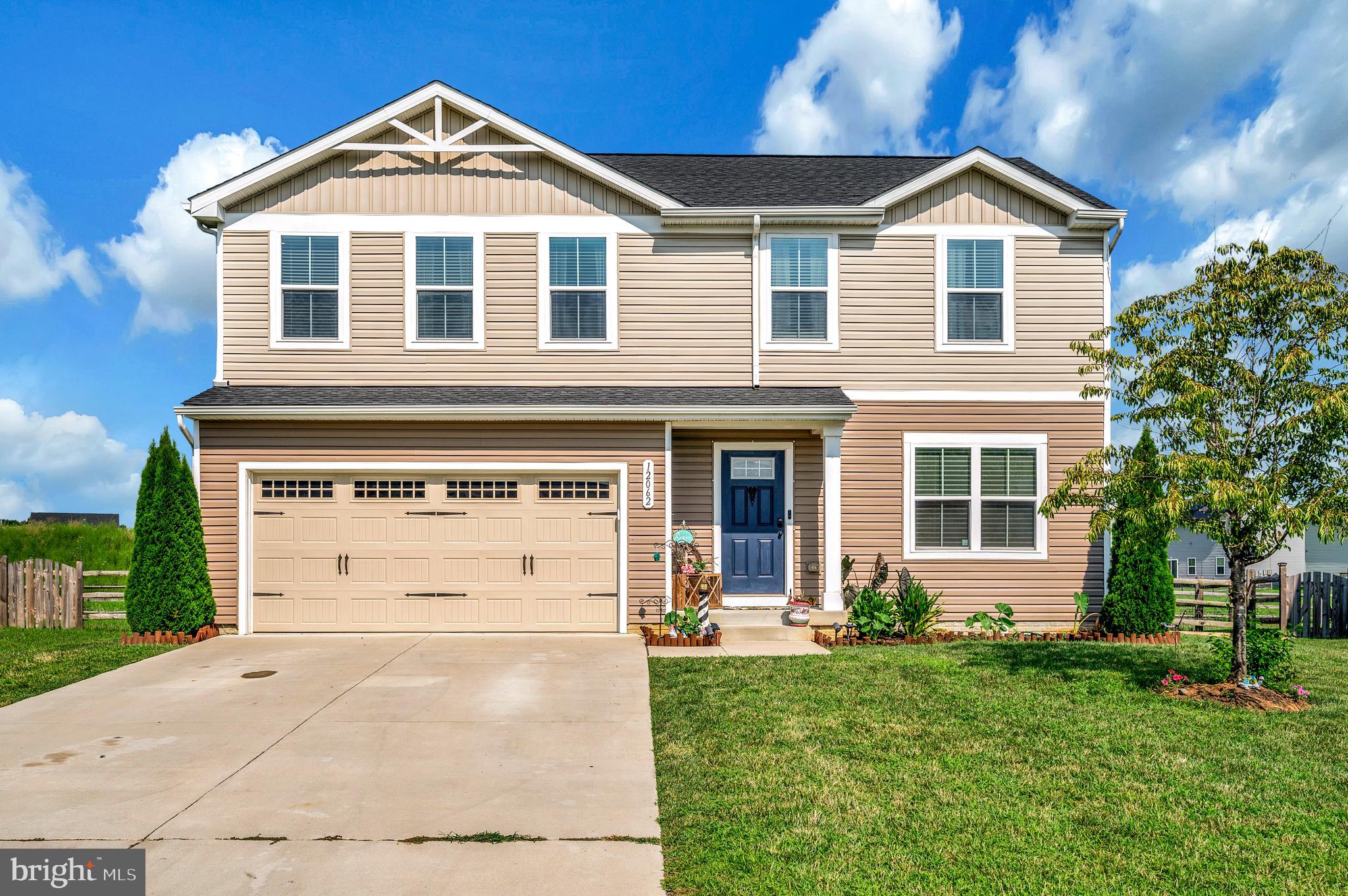 12062 Rundle Crossing King George, VA 22485 - Photo 3 of 67 a front view of a house with a yard