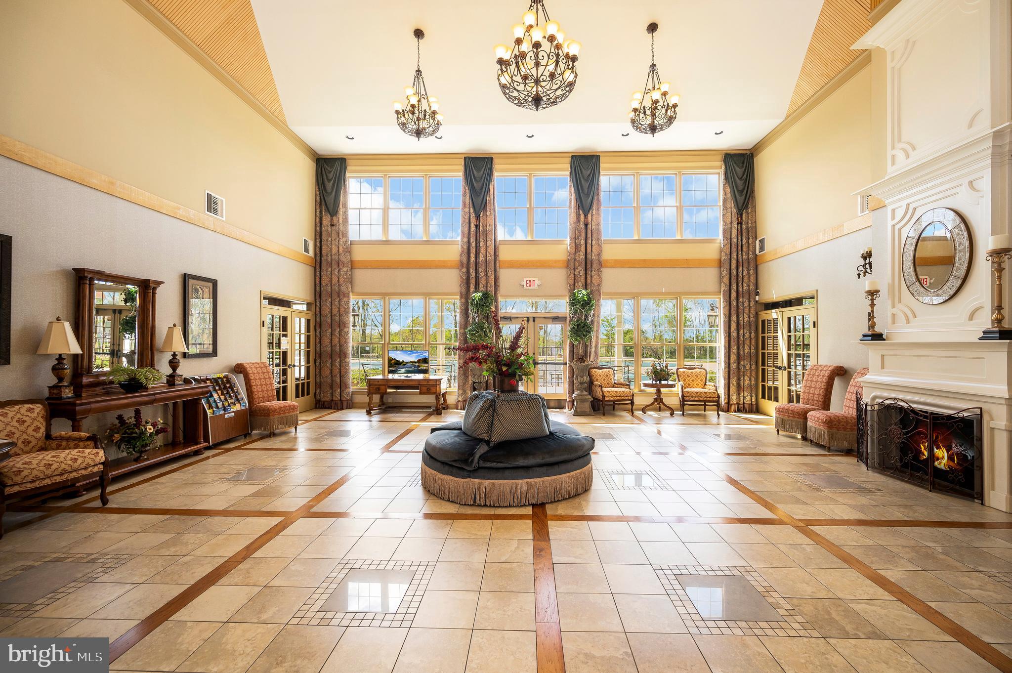 12062 Rundle Crossing King George, VA 22485 - Photo 62 of 67 a living room with furniture a fireplace and a large window