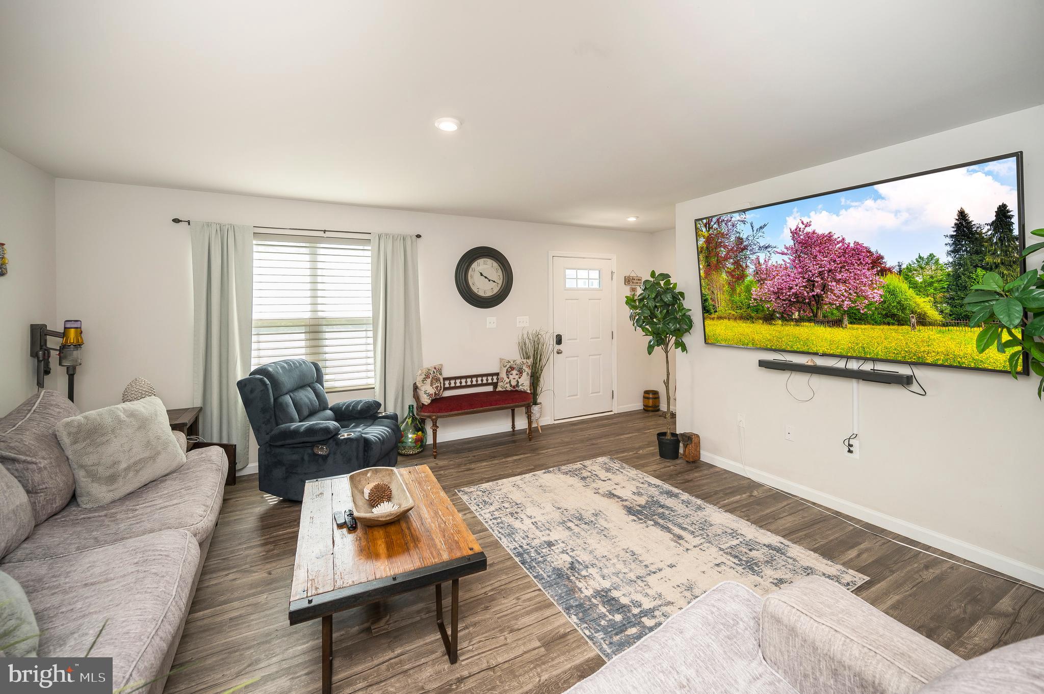 12062 Rundle Crossing King George, VA 22485 - Photo 7 of 67 a living room with furniture and a flat screen tv