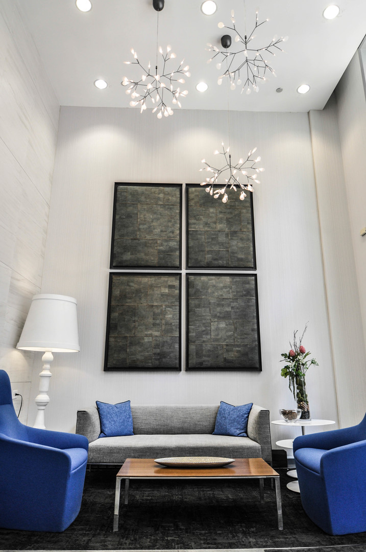 8 East Randolph Street, Unit 2807 Chicago, IL 60601 - Photo 2 of 37 a living room with furniture and a chandelier