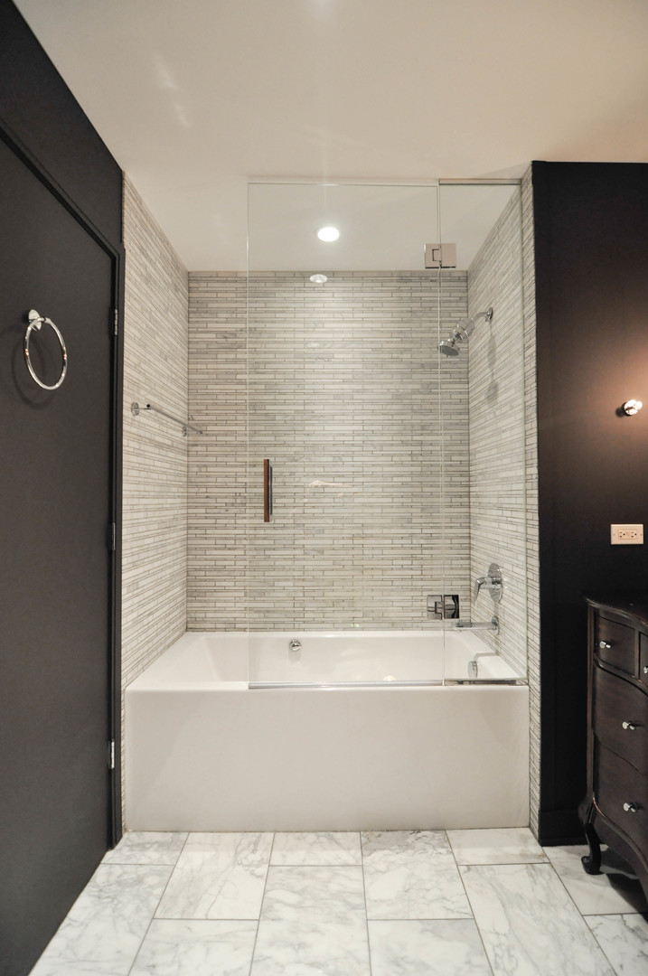 8 East Randolph Street, Unit 2807 Chicago, IL 60601 - Photo 17 of 37 a bathroom with a bathtub and a shower