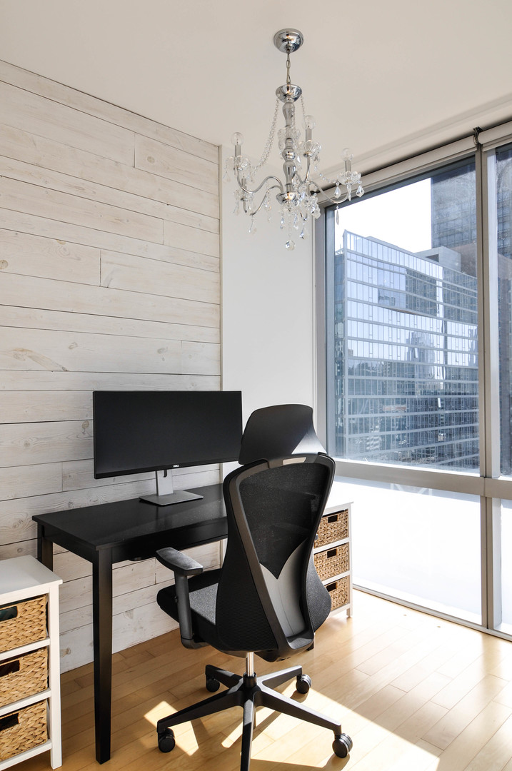 8 East Randolph Street, Unit 2807 Chicago, IL 60601 - Photo 18 of 37 a view of a workspace with furniture and a window