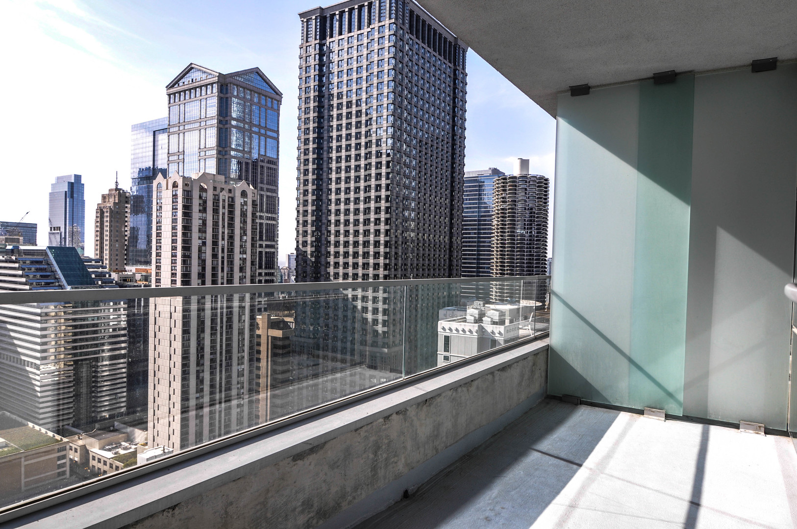 8 East Randolph Street, Unit 2807 Chicago, IL 60601 - Photo 19 of 37 a balcony with a book shelf