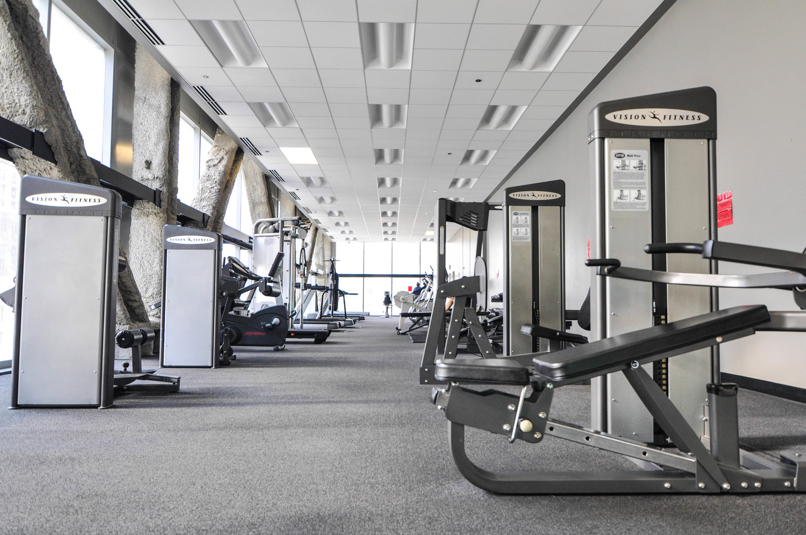 8 East Randolph Street, Unit 2807 Chicago, IL 60601 - Photo 32 of 37 a room with lots of gym equipment