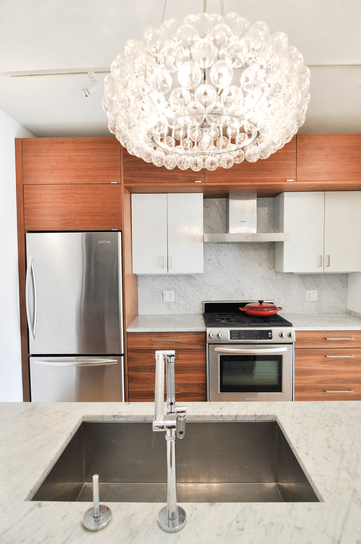 8 East Randolph Street, Unit 2807 Chicago, IL 60601 - Photo 7 of 37 a kitchen with a sink a stove and a refrigerator