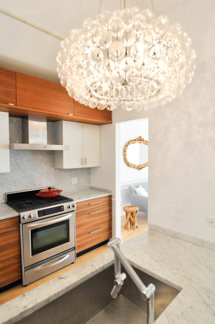 8 East Randolph Street, Unit 2807 Chicago, IL 60601 - Photo 8 of 37 a kitchen with a stove and a white cabinets