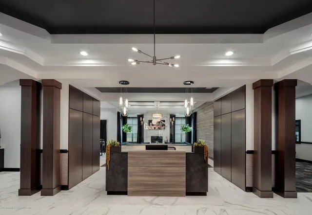 a view of lobby with a ceiling fan