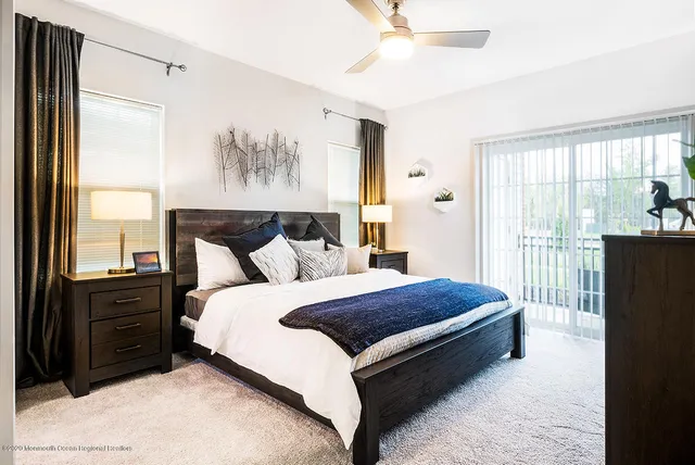 a bed room with a bed and a window