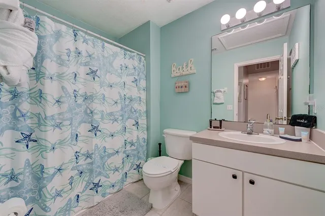 an aerial view of a house with garden space and street view