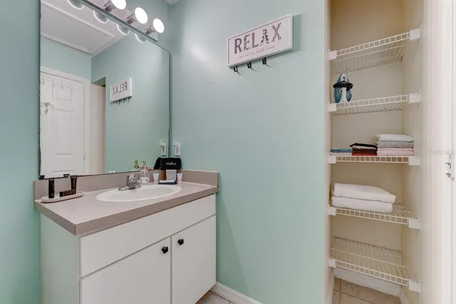 an aerial view of residential houses with outdoor space and river view