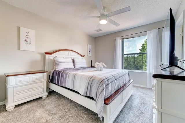 a front view of a house with a yard and a garage