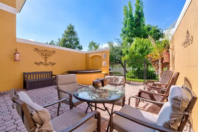 a view of a swimming pool with sitting area