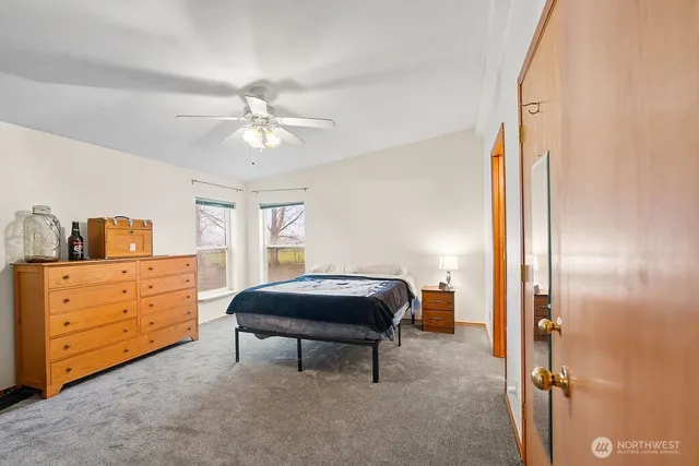 a room with a dresser and a chandelier