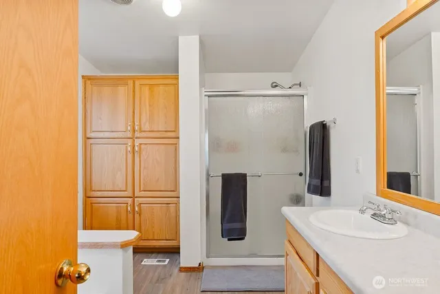 a bathroom with a sink and a mirror