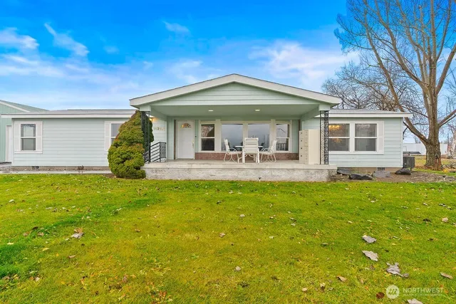 a front view of house with yard and porch