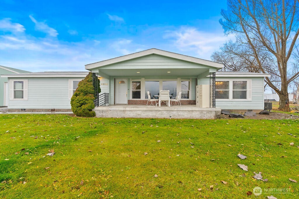 163106 West North River Road Prosser, WA 99350 - Photo 4 of 31 a front view of house with yard and porch