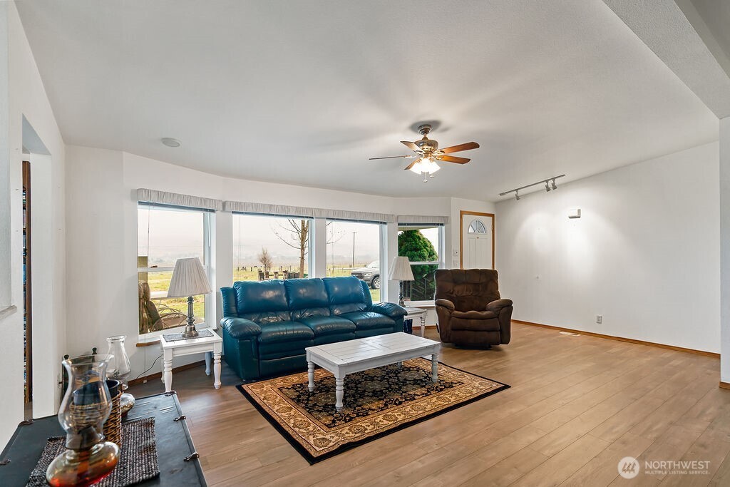 163106 West North River Road Prosser, WA 99350 - Photo 5 of 31 a living room with furniture and a large window