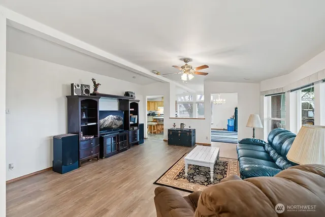 a living room with furniture and a flat screen tv