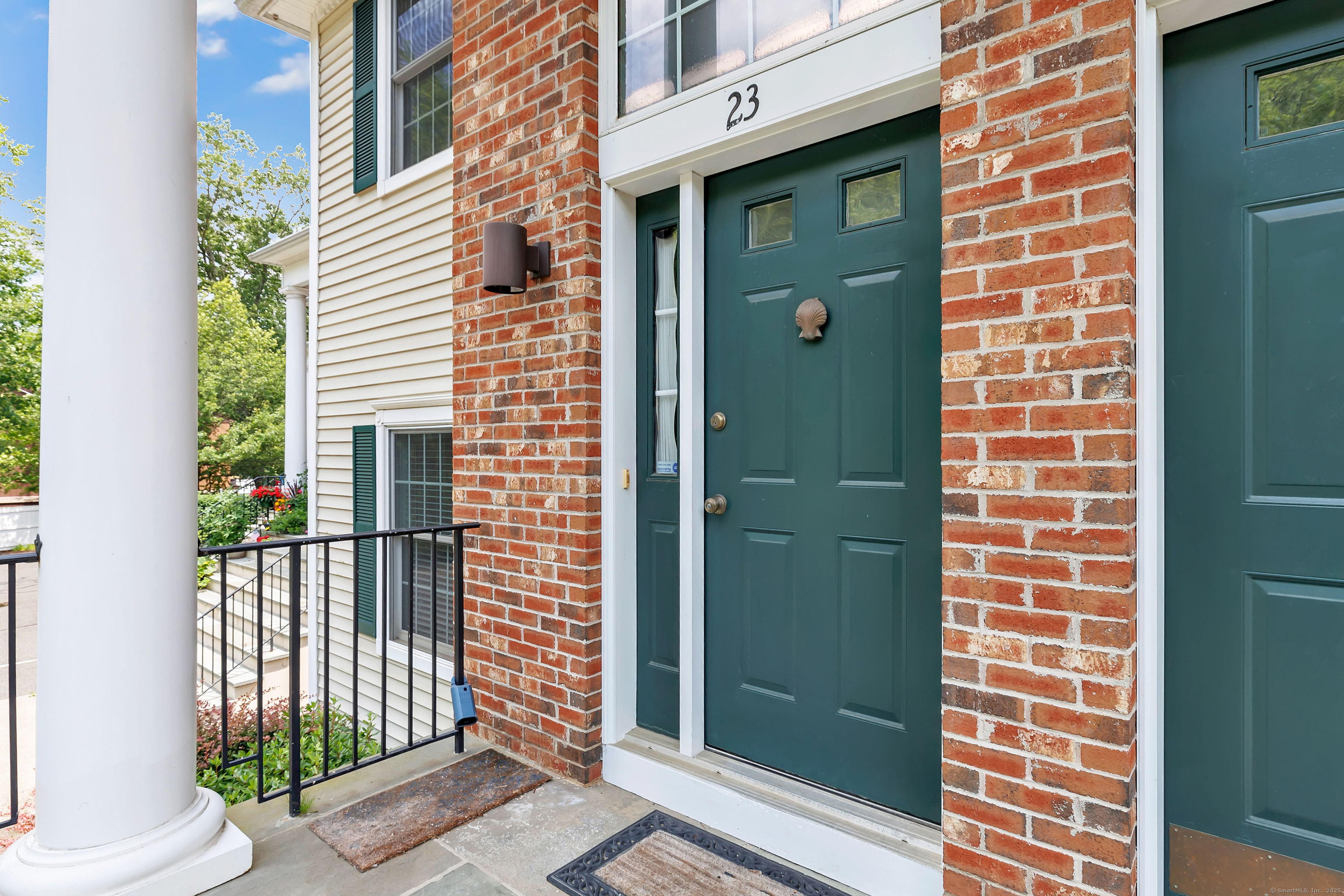 a view of a door and a window