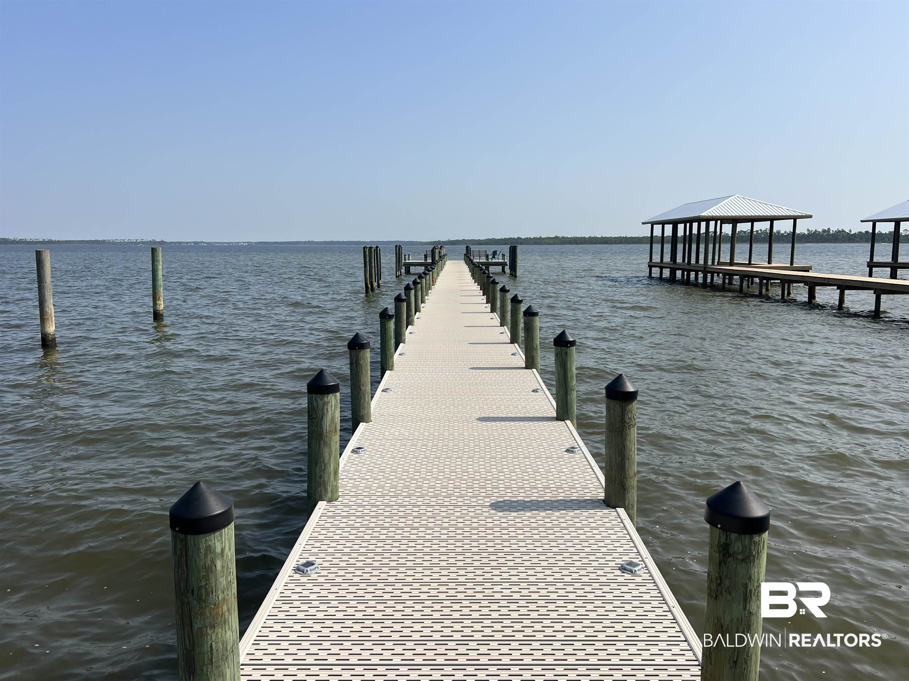 25957 Canal Road, Unit 203 Orange Beach, AL 36561 - Photo 24 of 28 Dock area featuring a water view