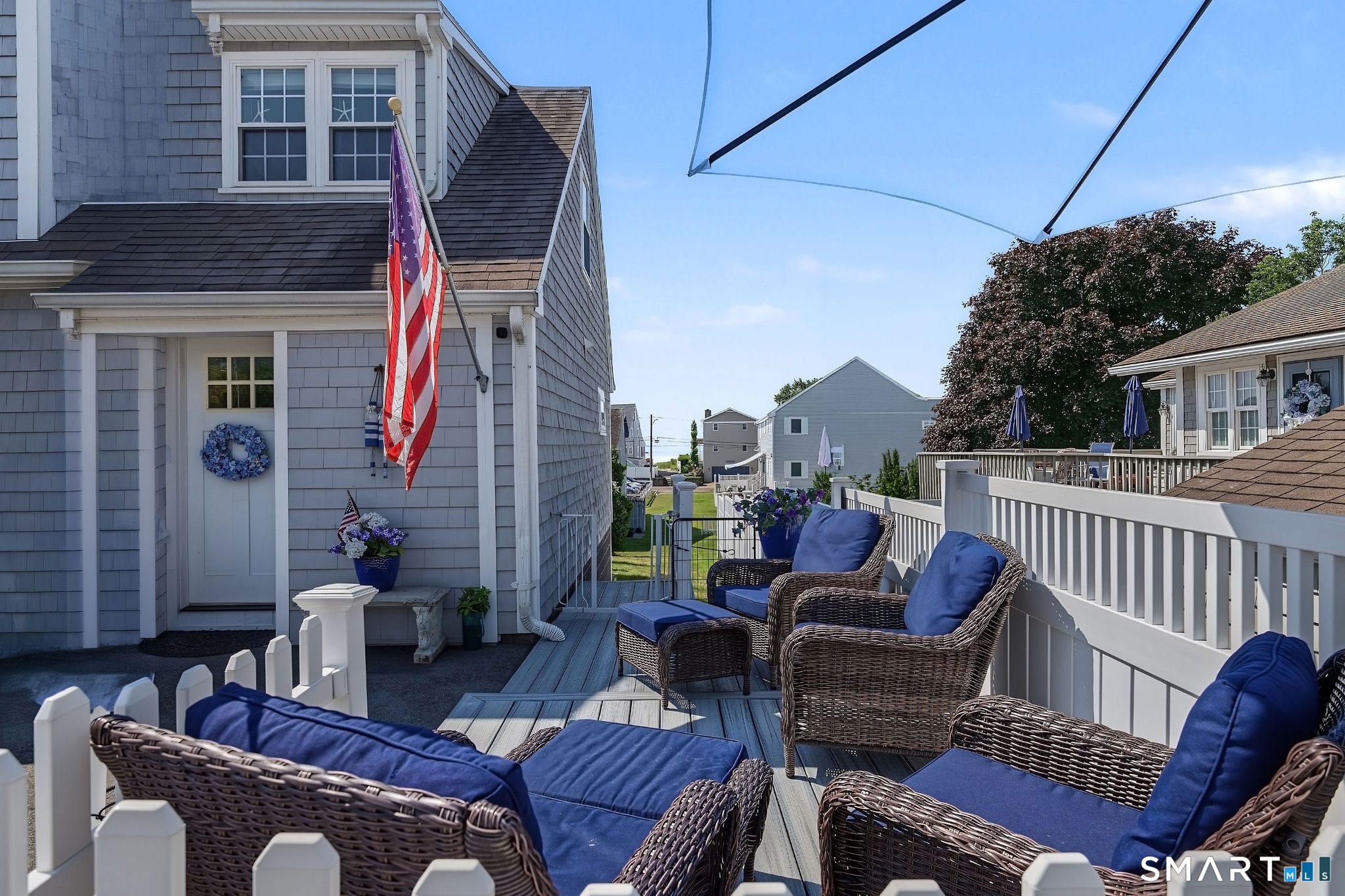 3 Mohican Road West Westbrook, CT 06498 - Photo 2 of 40 The side patio looks directly down the right-of-way to the beach.