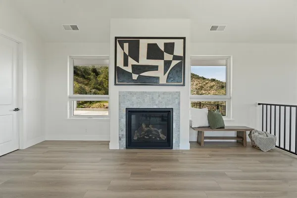 a living room with furniture and a fireplace