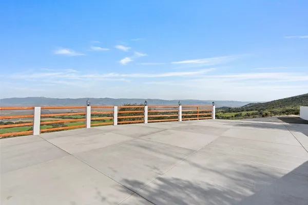 a view of an ocean with a floor to ceiling window