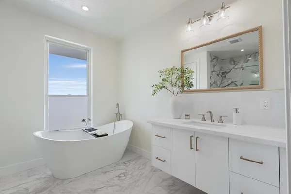 a view of cabinets a wooden floor and a window