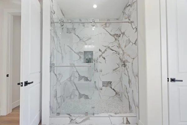 a spacious bedroom with a bed and a window