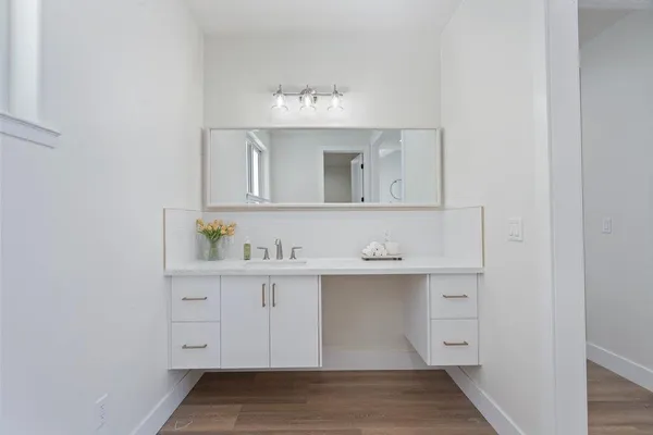 a bedroom with a bed and dresser