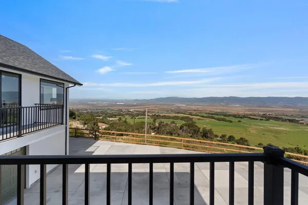 a view of a lake from a balcony