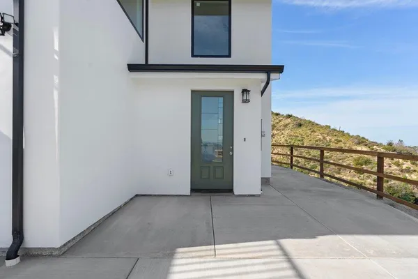 a view of a wooden door and an outdoor space