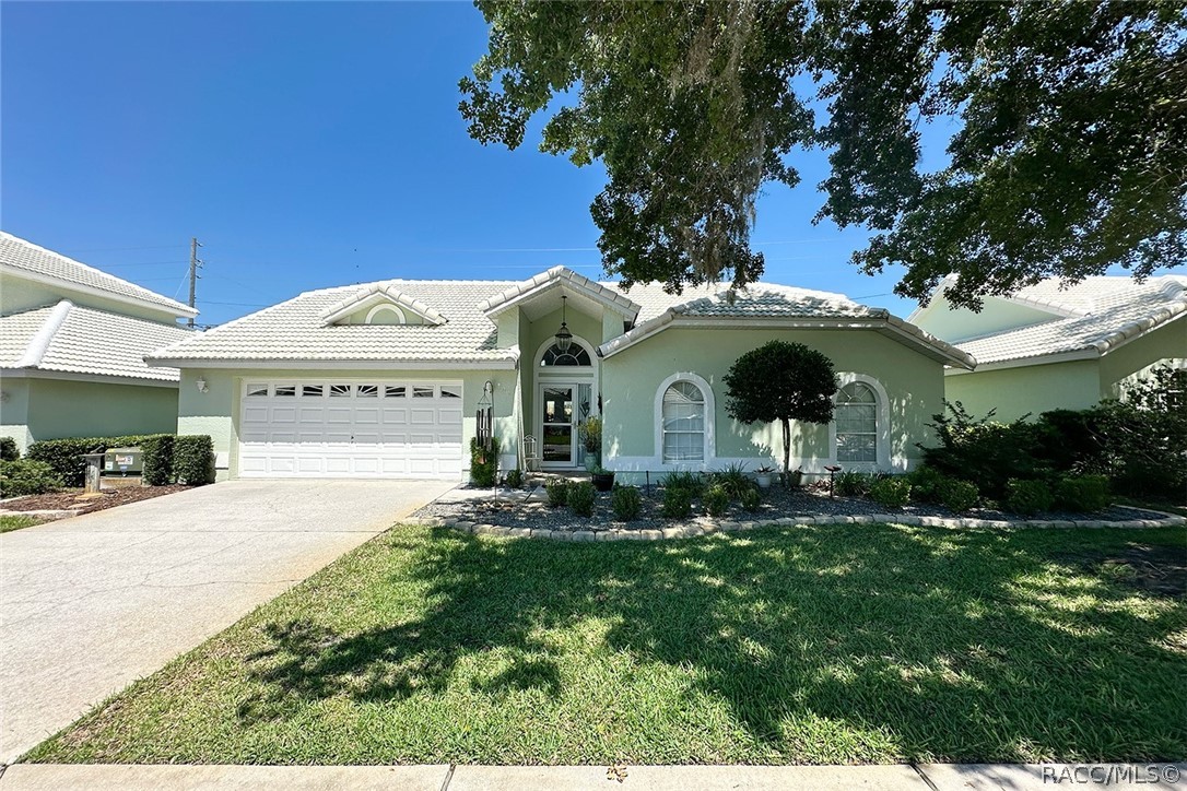 800 Balmoral Court Inverness, FL 34453 - Photo 44 of 72 a front view of a house with a yard