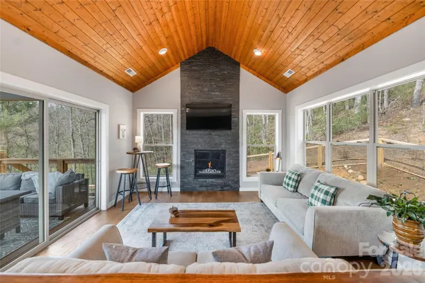 a balcony with wooden floor and furniture
