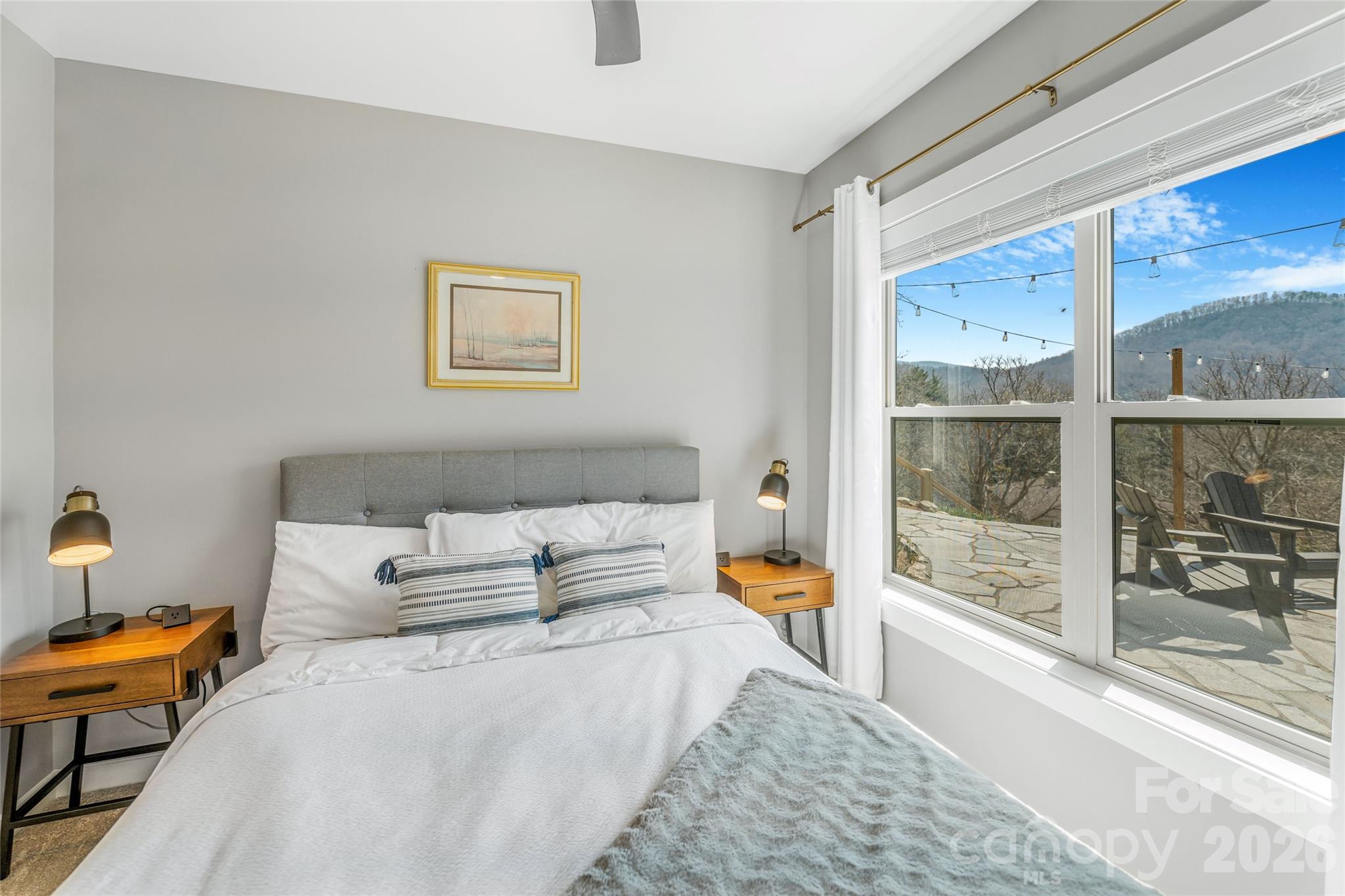 54 Weldon Way Fairview, NC 28730 - Photo 31 of 47 a bedroom with a large bed and a large window