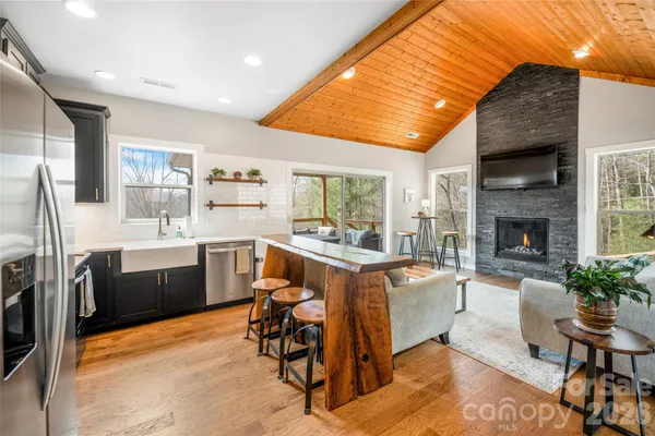 a kitchen with a sink appliances and cabinets