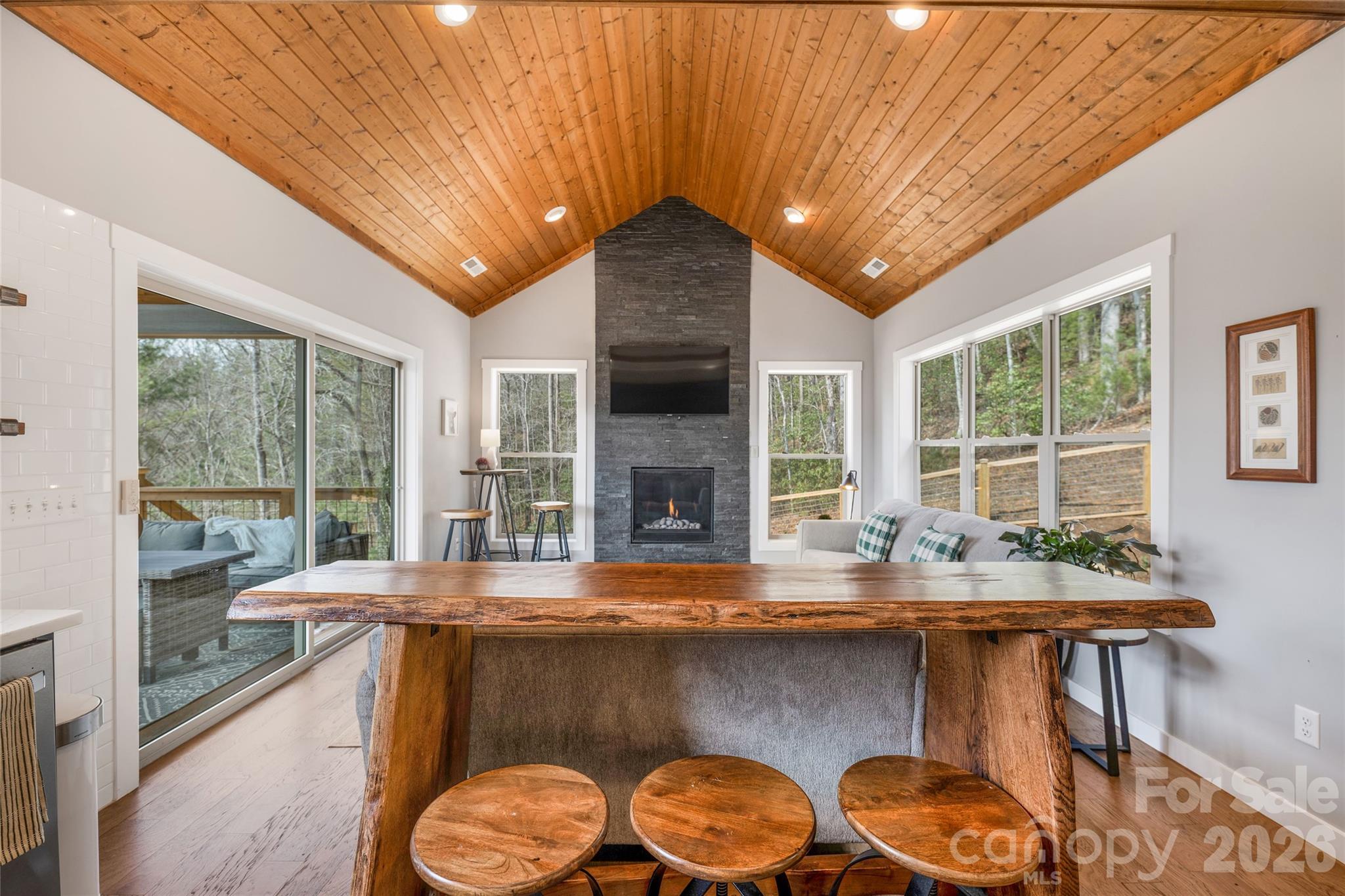 54 Weldon Way Fairview, NC 28730 - Photo 7 of 47 a dining room with fireplace furniture and a large window