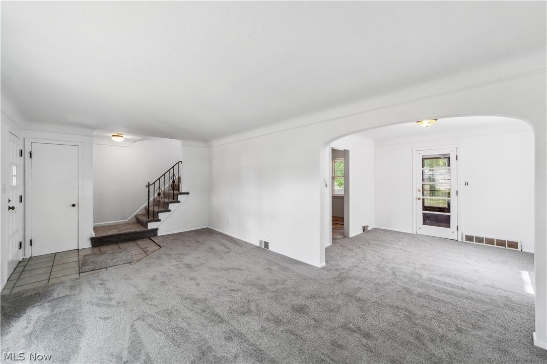 1655 Lyndhurst Road Cleveland, OH 44124 - Photo 4 of 30 Unfurnished living room featuring crown molding and carpet floors