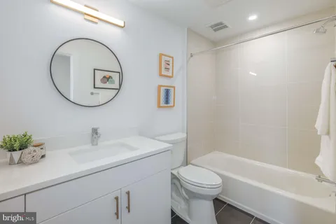 a bathroom with a sink a toilet and a bathtub