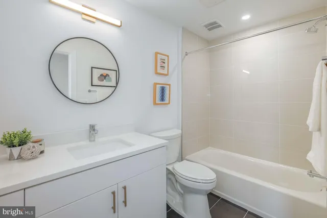 a bathroom with a sink a toilet and a bathtub