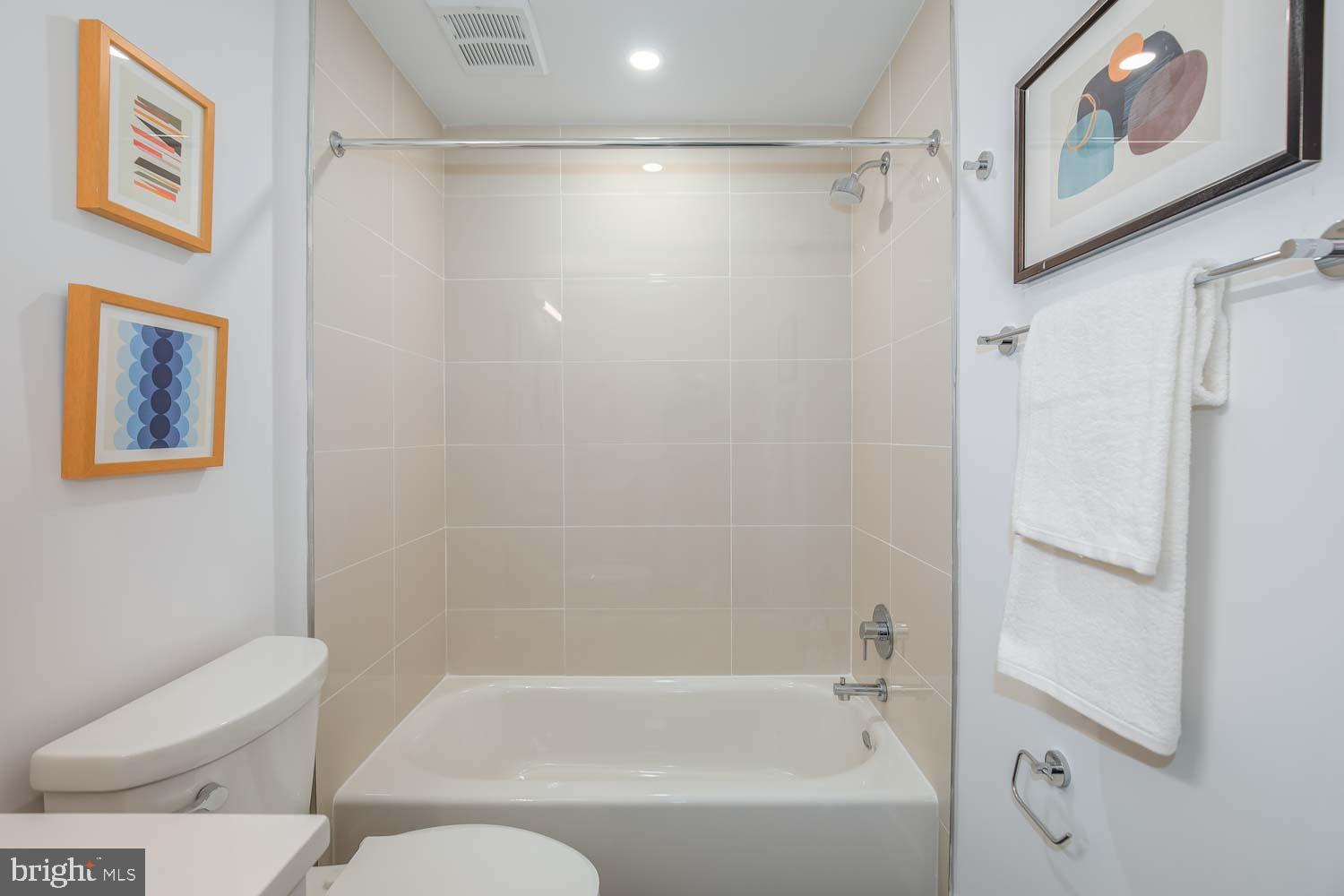 2310 4th Street Northeast, Unit 22 Washington, DC 20002 - Photo 12 of 18 a bathroom with a bathtub and shower