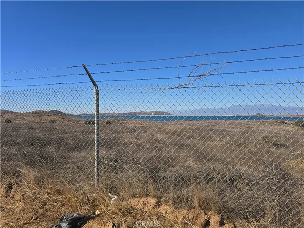 a street sign on a wall next to road