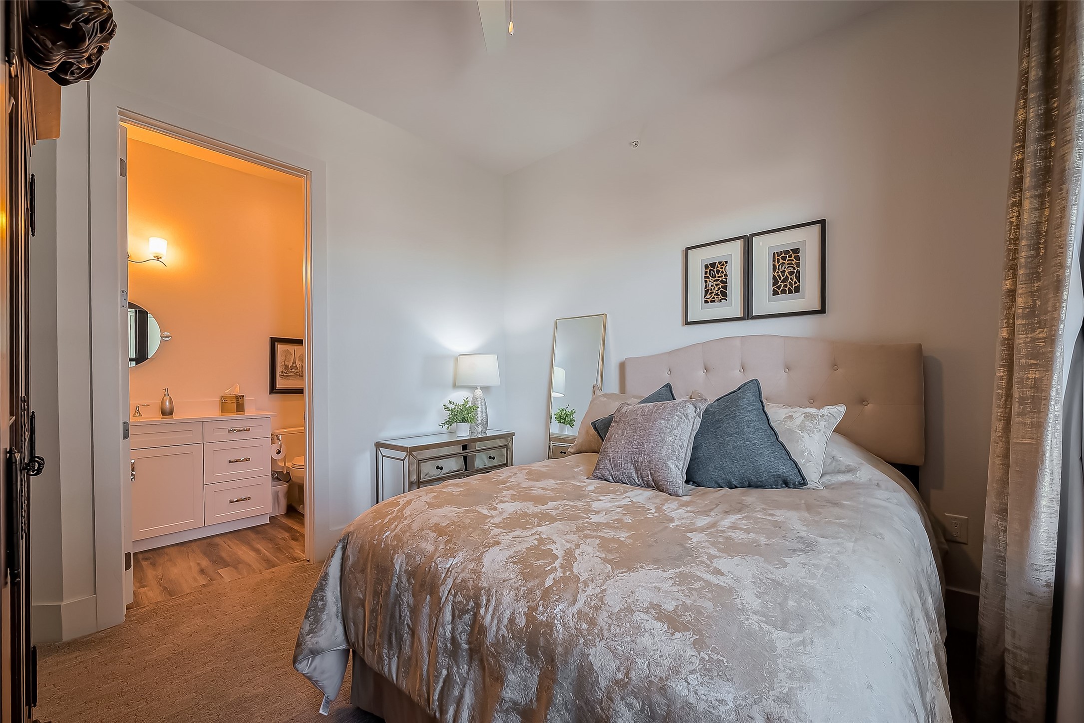 199 Waterpoint Court, Unit 302 Conroe, TX 77356 - Photo 12 of 20 Secondary bedroom designed with a private ensuite bath, perfect for guests or flexible living.