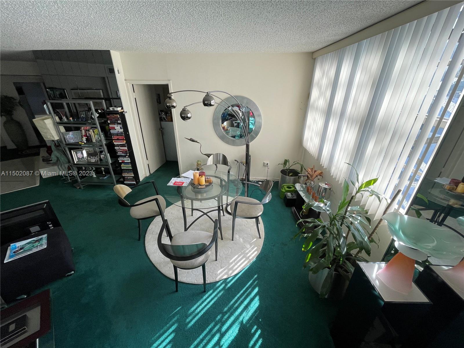 999 Brickell Bay Drive, Unit 1908 Miami, FL 33131 - Photo 39 of 57 a vase of flowers sitting on a table