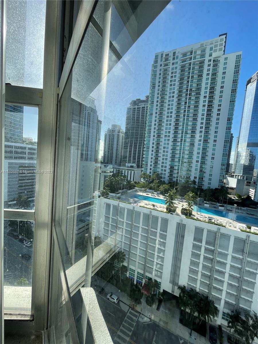 999 Brickell Bay Drive, Unit 1908 Miami, FL 33131 - Photo 51 of 57 a view of a balcony with a potted plant